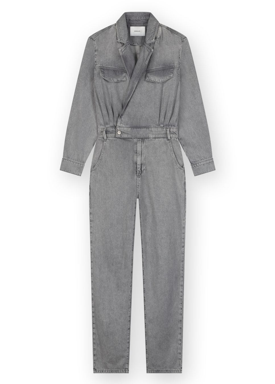 Grijze denim cross over jumpsuit van het merk Homage. De grijze denim jumpsuit van Homage heeft een V-hals, lange mouwen en elastische tailleband. De grijze denim jumpsuit draag je zowel met sneakers als hakken. Shop de nieuwe collectie denim jumpsuits, grijze jumpsuits, Homage jumpsuits bij dameskleding Boetiek Aniek